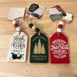 Set of three Christmas stocking tags with beaded hangers
